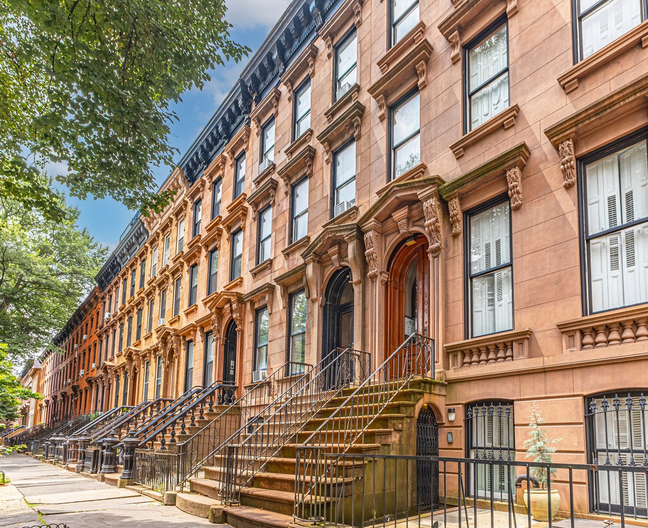 Historic brownstones, townhouses, and multifamily homes along Greene Avenue in Bedford-Stuyvesant, Brooklyn.