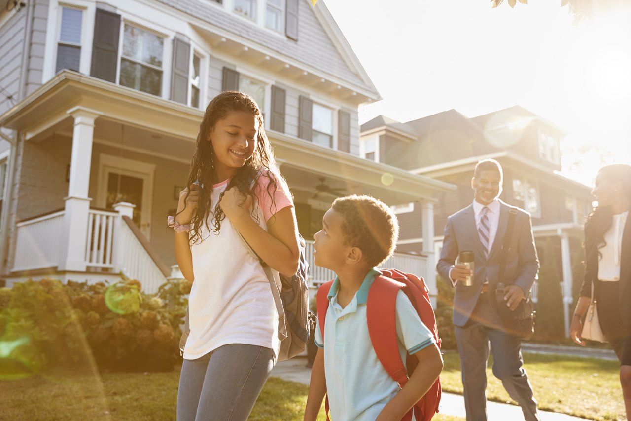 young girl and boy with backpacks