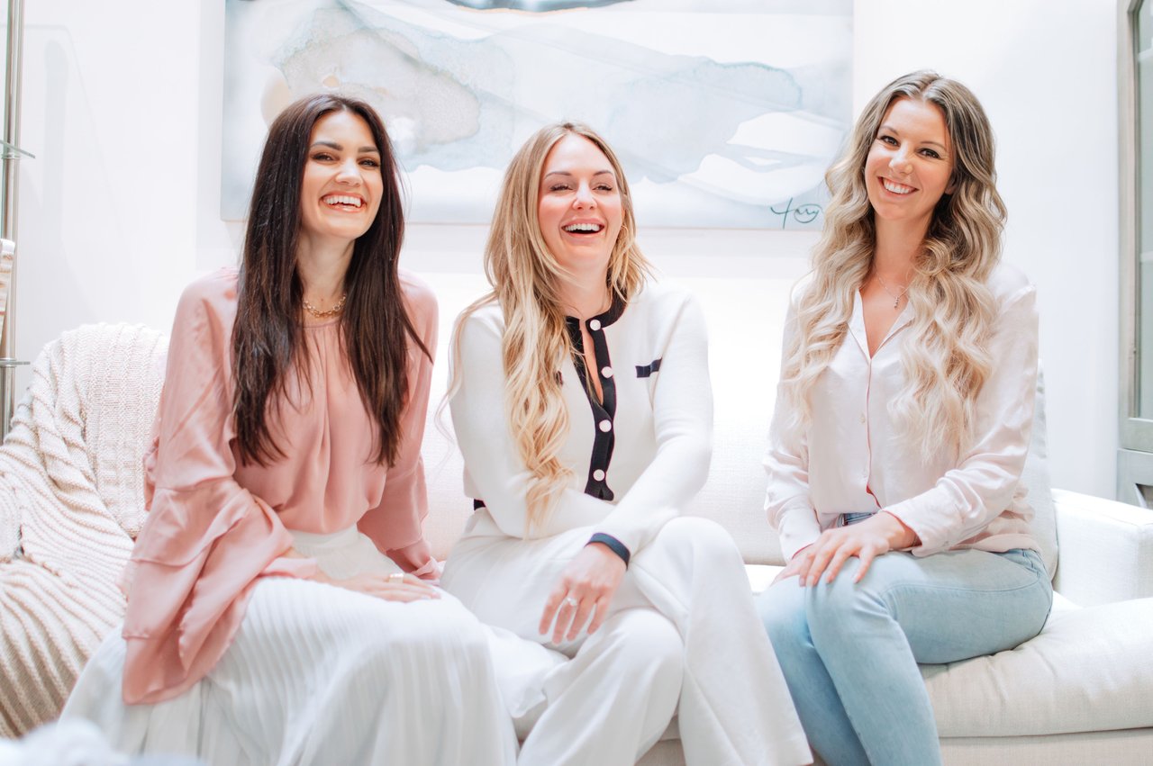 The team behind Coastal Living Collective — three smiling women representing real estate expertise and community-focused service in Victoria, BC.
