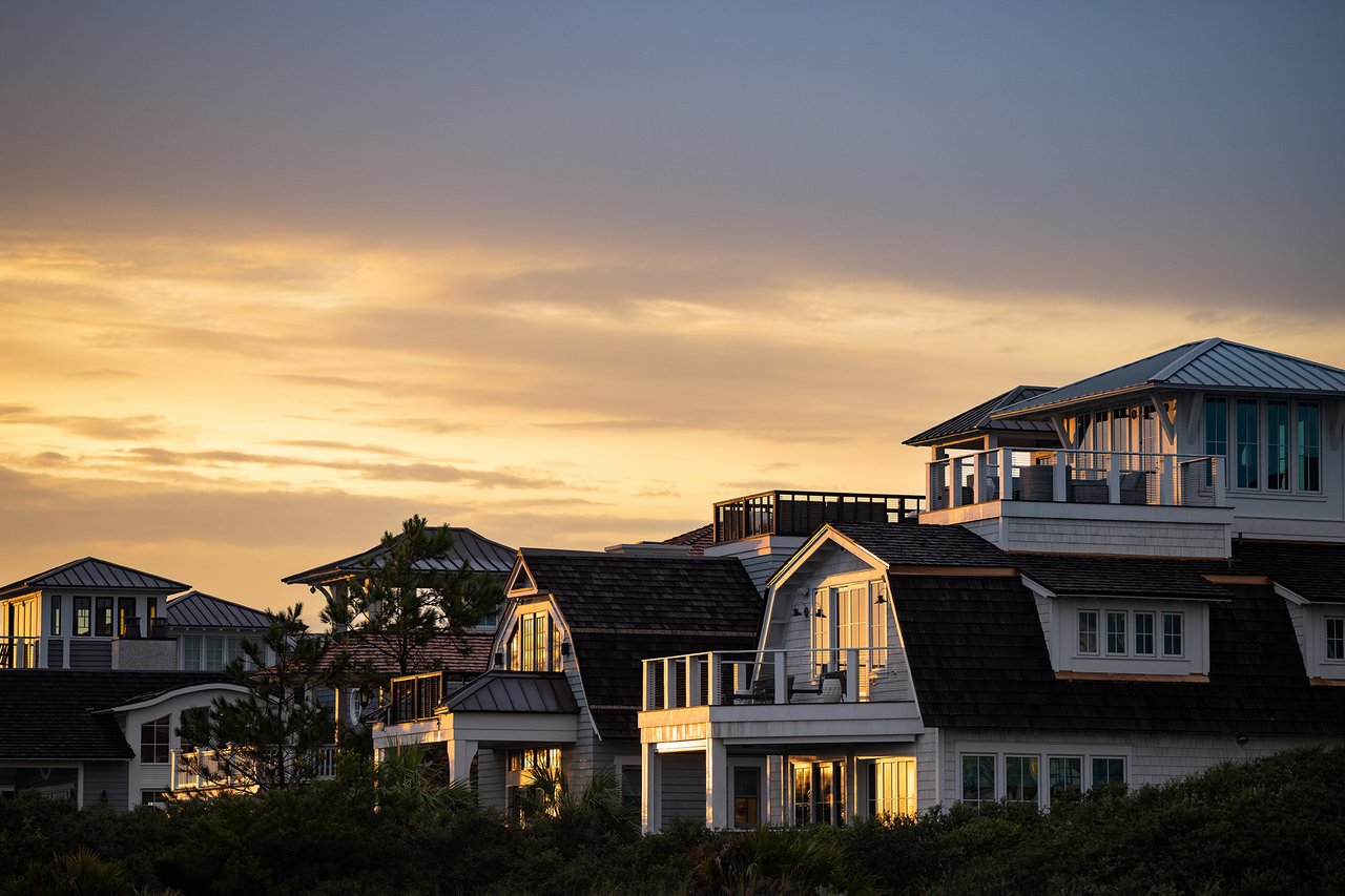 Homes warmly lit by sunset in Watersound Beach Florida.