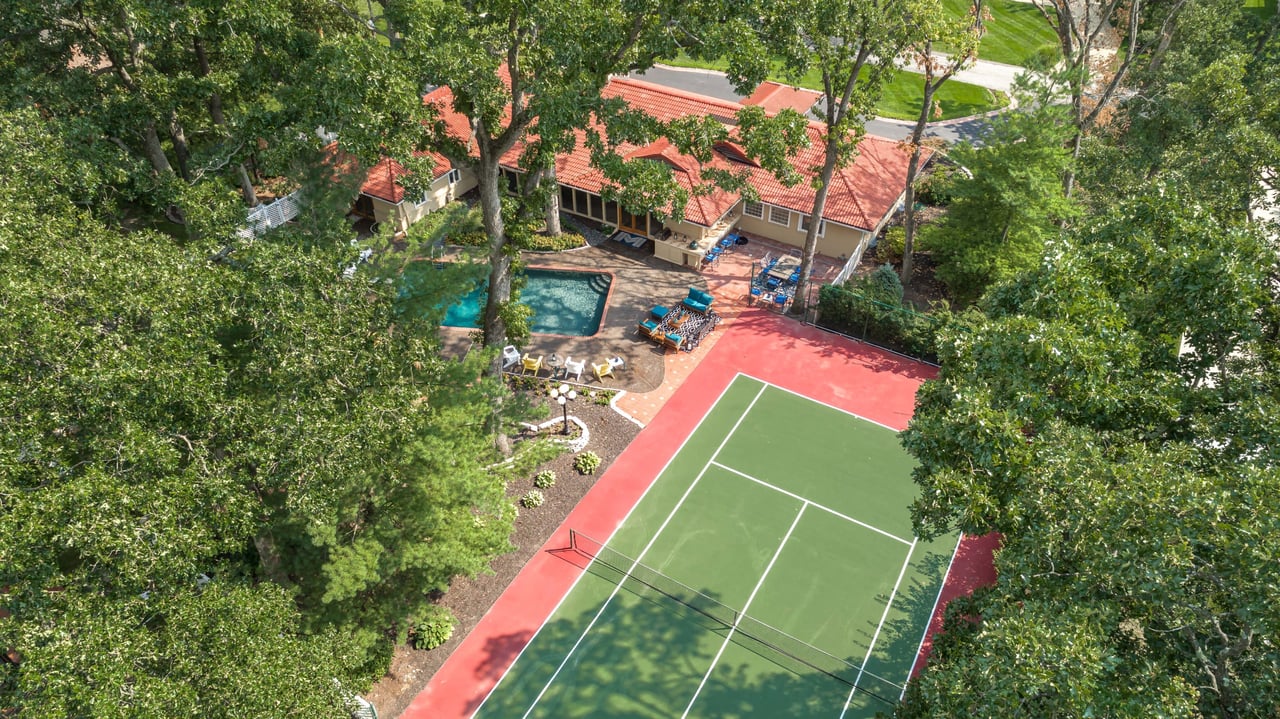 A Special Retreat on a Prized One Acre Lot With Pool and Tennis Court