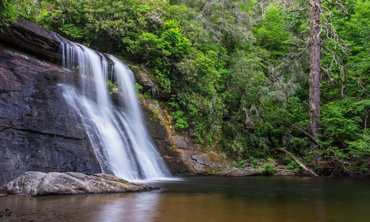 Rushing waters down a steep rock face on Lake Glenville, north carolina