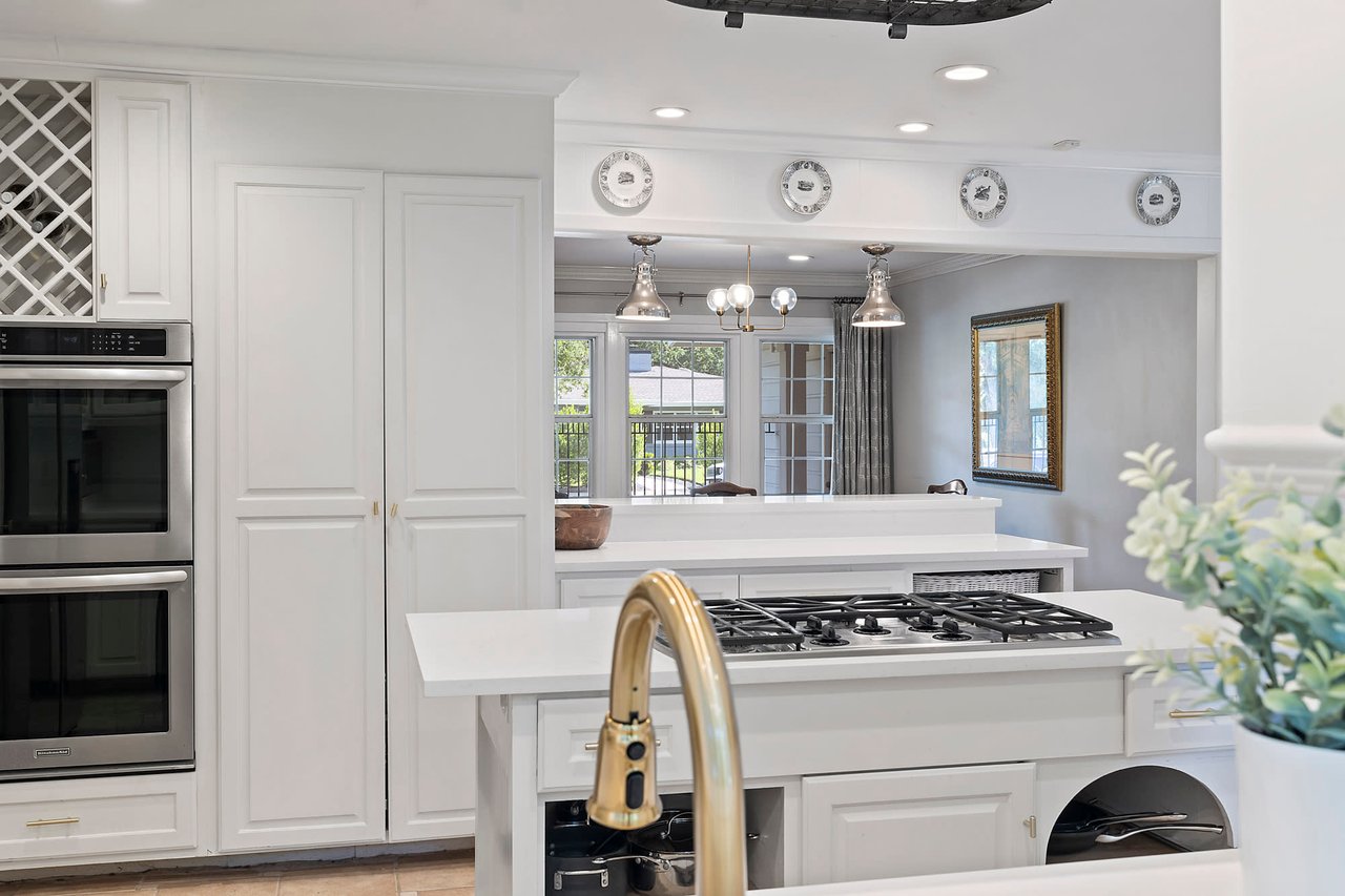 Kitchen with white cabinetry and a gas cooktop, 2404 Westover Rd, Tarrytown.