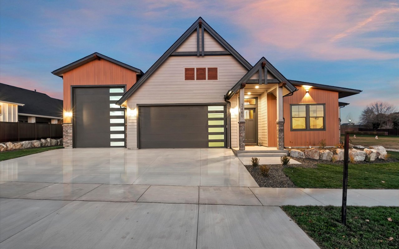 Modern craftsman with steep gables and mix of painted and wood siding