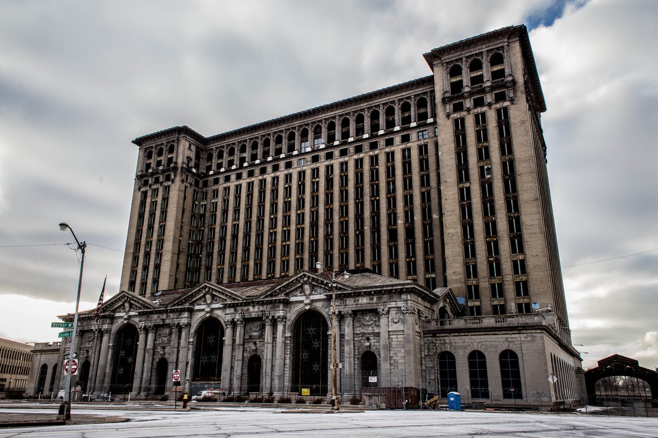 Abandoned Michigan Central Station in Detroit, its ornate facade beneath a cloudy winter sky.