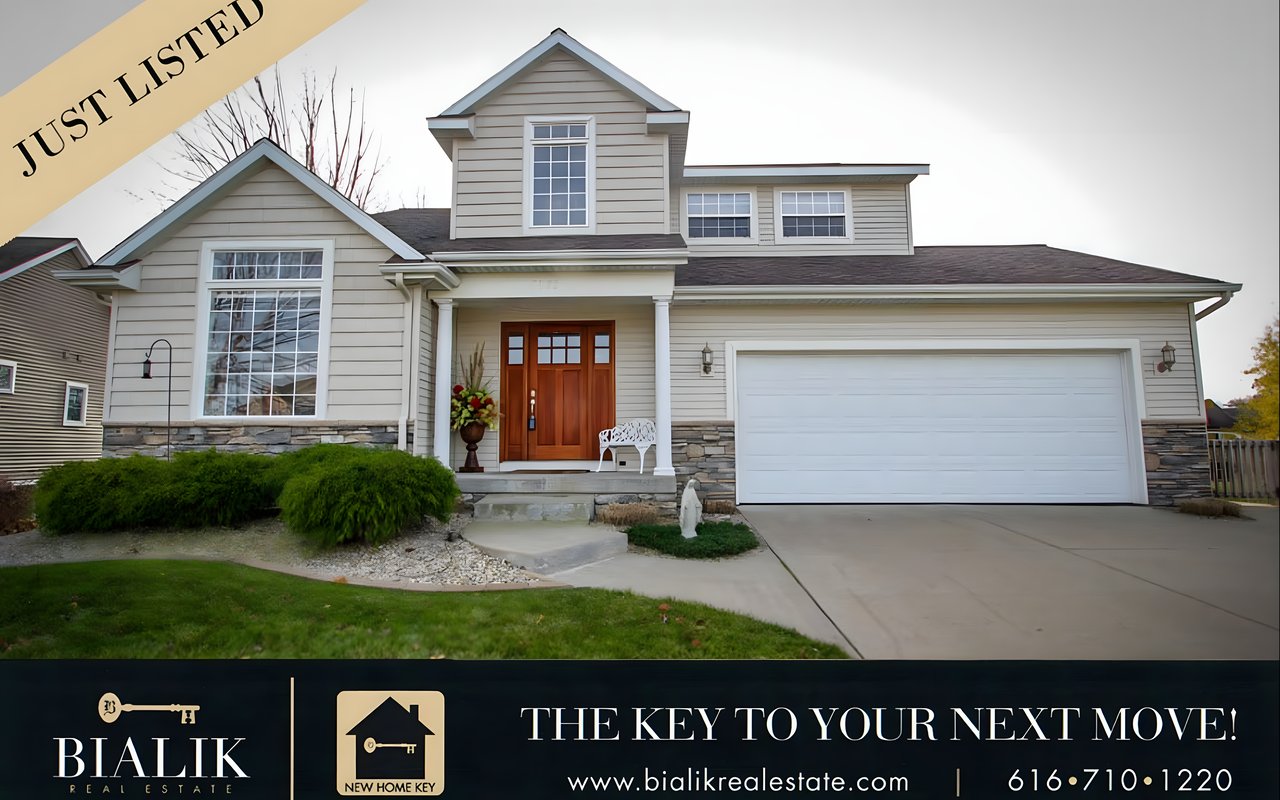 Two-story home with a stone-accented facade, covered entry, wooden front door, and attached garage.