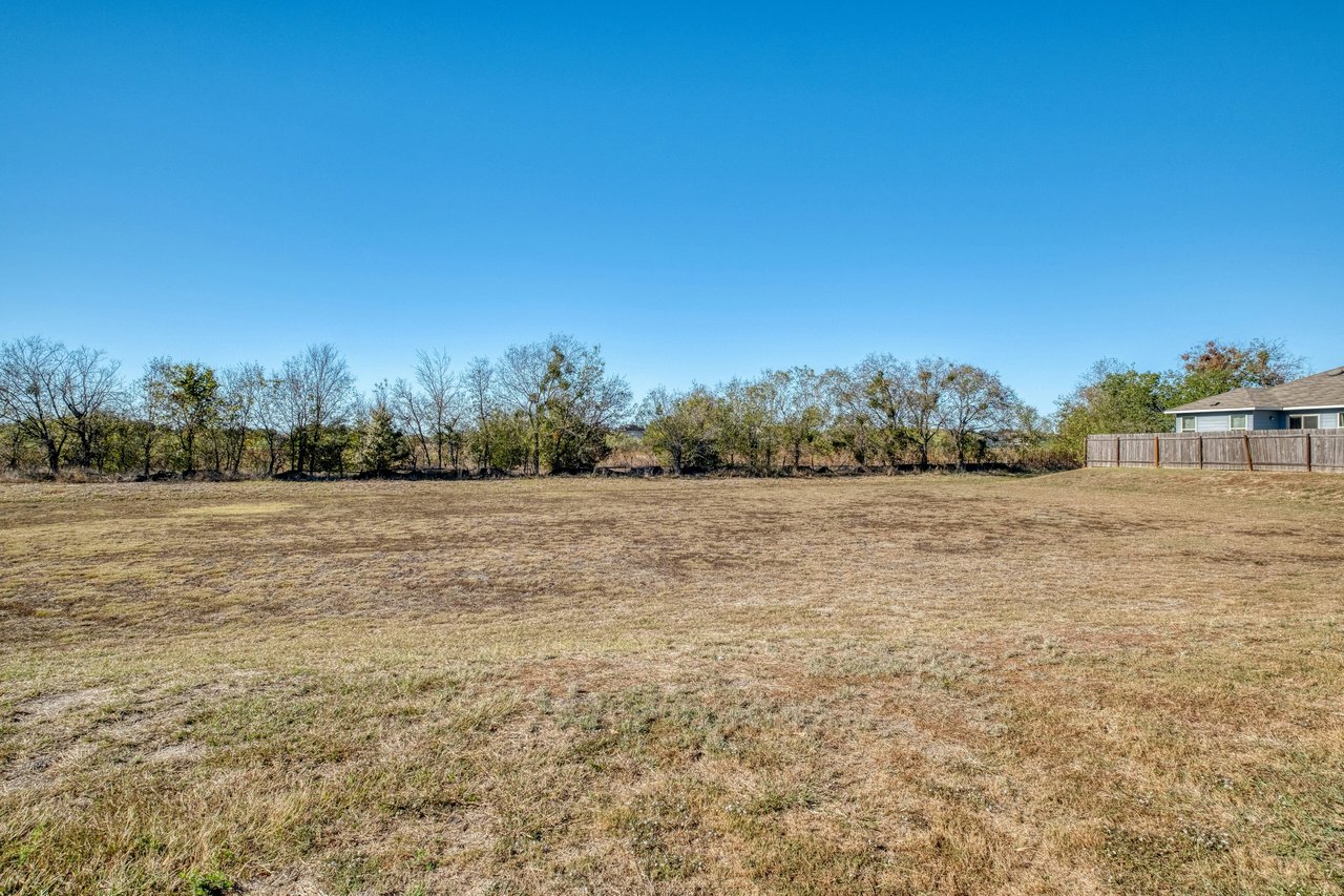Rare Cul-de-Sac Gem in Manor – With No Neighbor on One Side and Access to HOA-owned Greenspace Right Outside Your Doorstep!