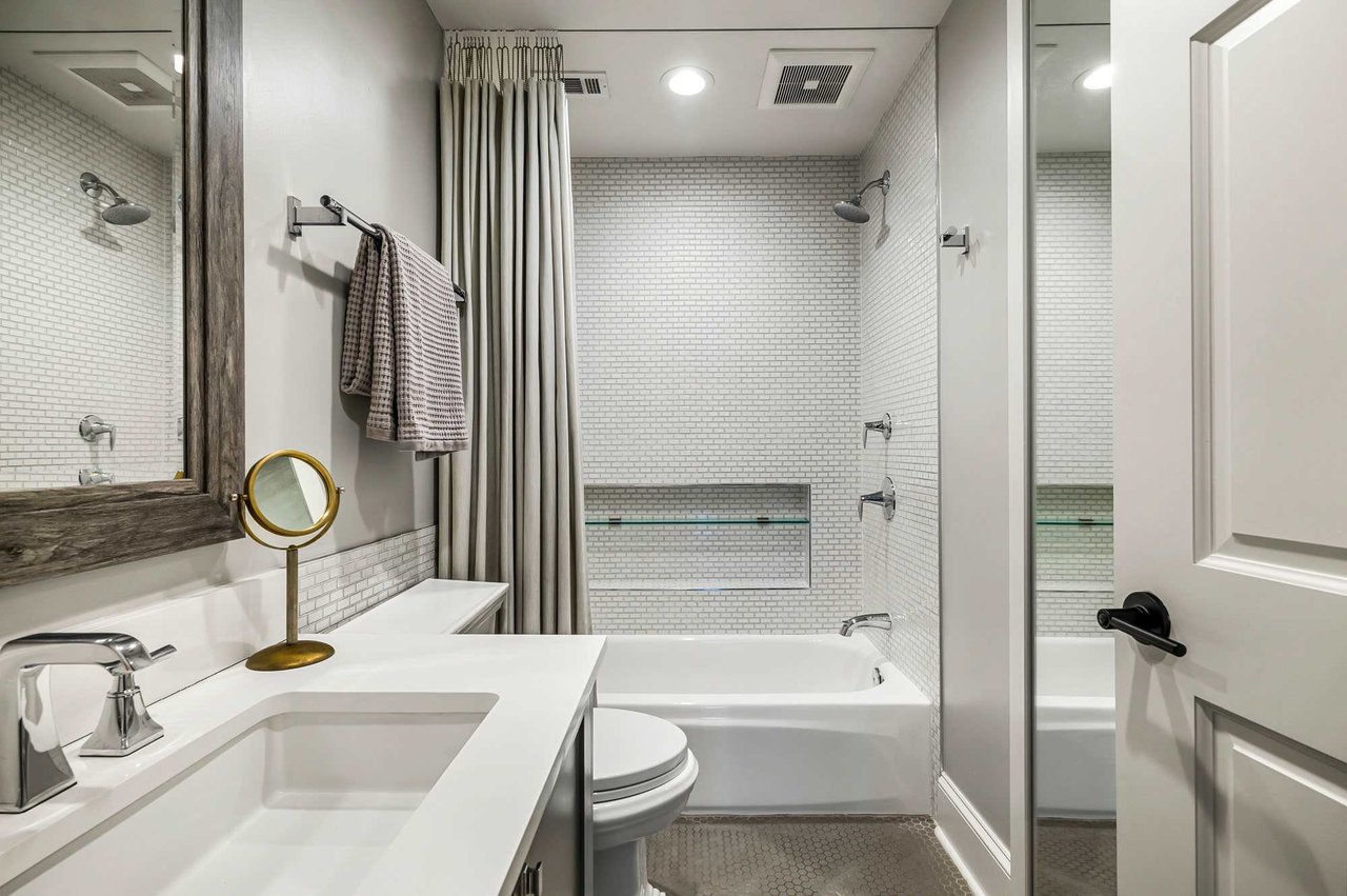 Bathroom with tub and shower combination at 1500 Northwood Rd, Pemberton Heights, Austin.