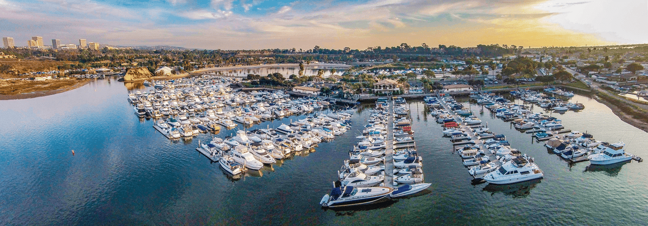 Aerial view of Newport Beach homes with private docks and marina access