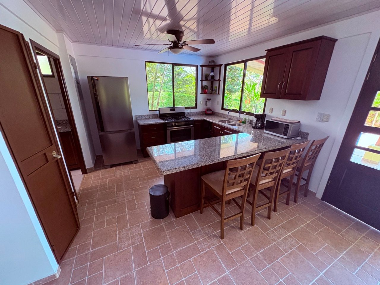 Move in ready 2 bedroom / 2 bathroom home with window ocean view and pool in Ojochal.