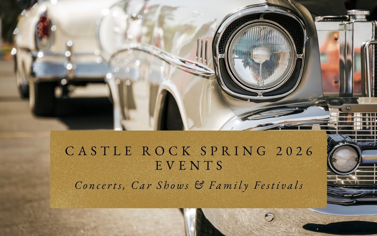 Classic cars lined along Wilcox Street during Castle Rock Car Show weekend with families browsing