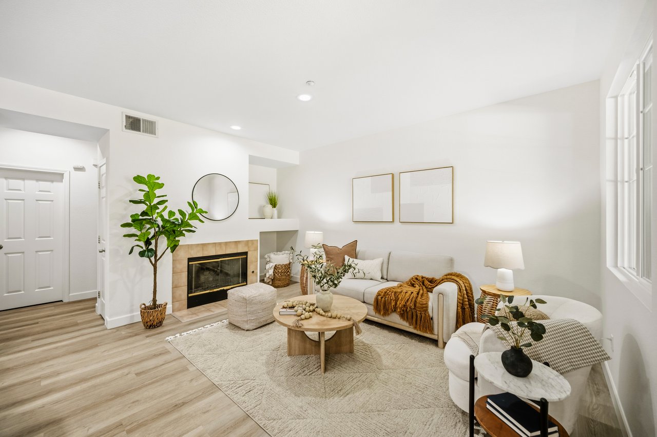Living room with a fireplace in a condo in the Copper Hill community in Livermore.