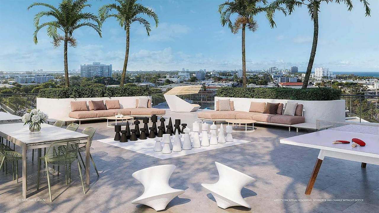 Furnished rooftop terrace with palm trees, oversized chess pieces, and a coastal city view.