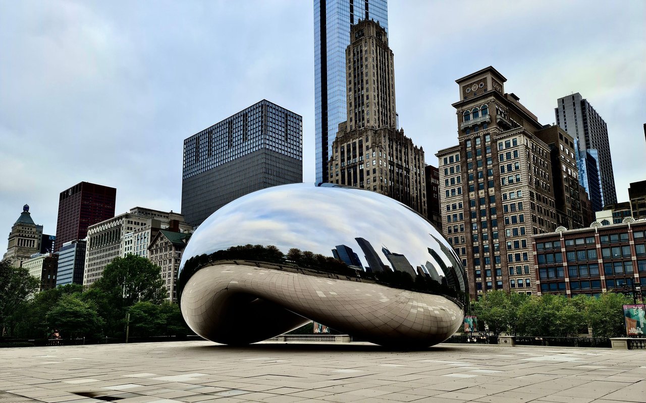 Cloud Gate sculpture reflects Chicago’s skyline in Millennium Park.