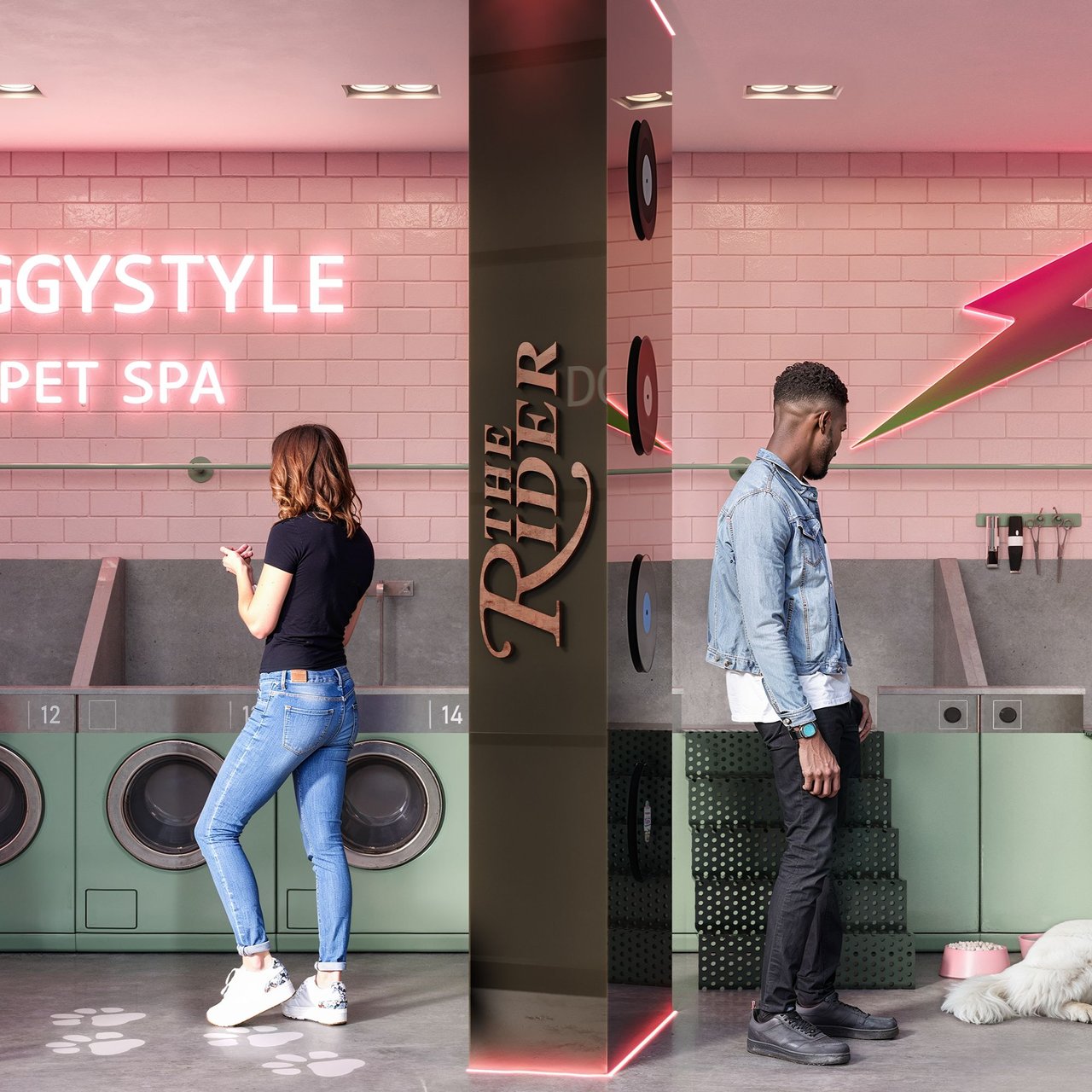 Pet spa at The Rider Residences with washing machines, paw-print decals and two people.