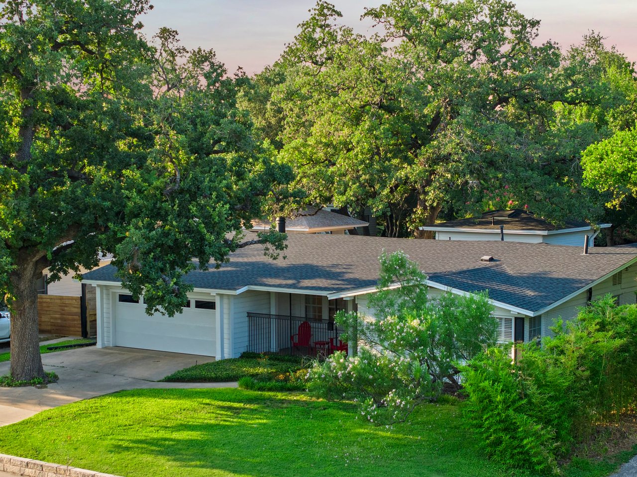 Aerial dusk view of the front yard and mature oak tree canopy, 2404 Westover Rd, Tarrytown.