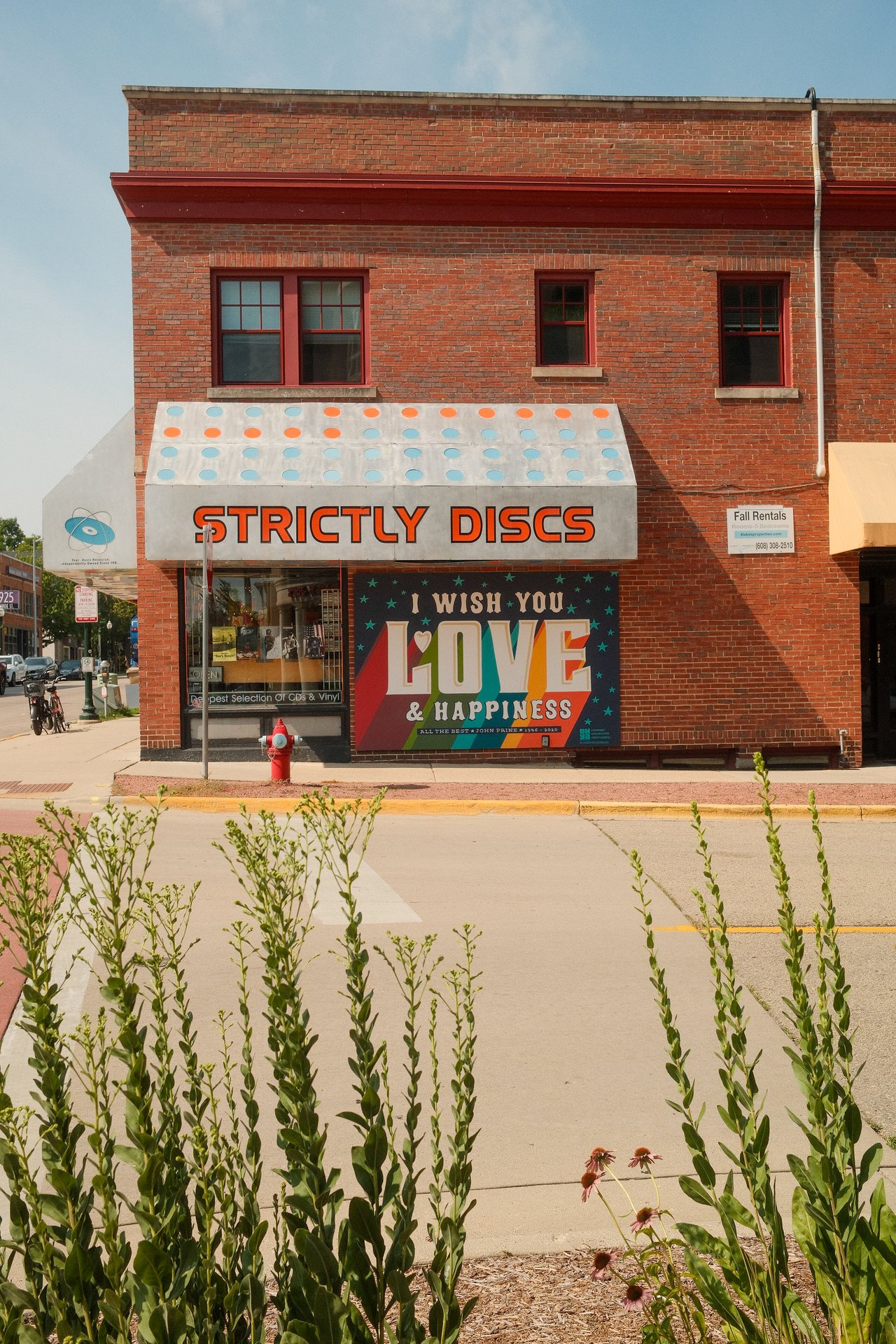 Colorful Love and Happiness mural outside Strictly Discs on Monroe Street in Madison, Wisconsin