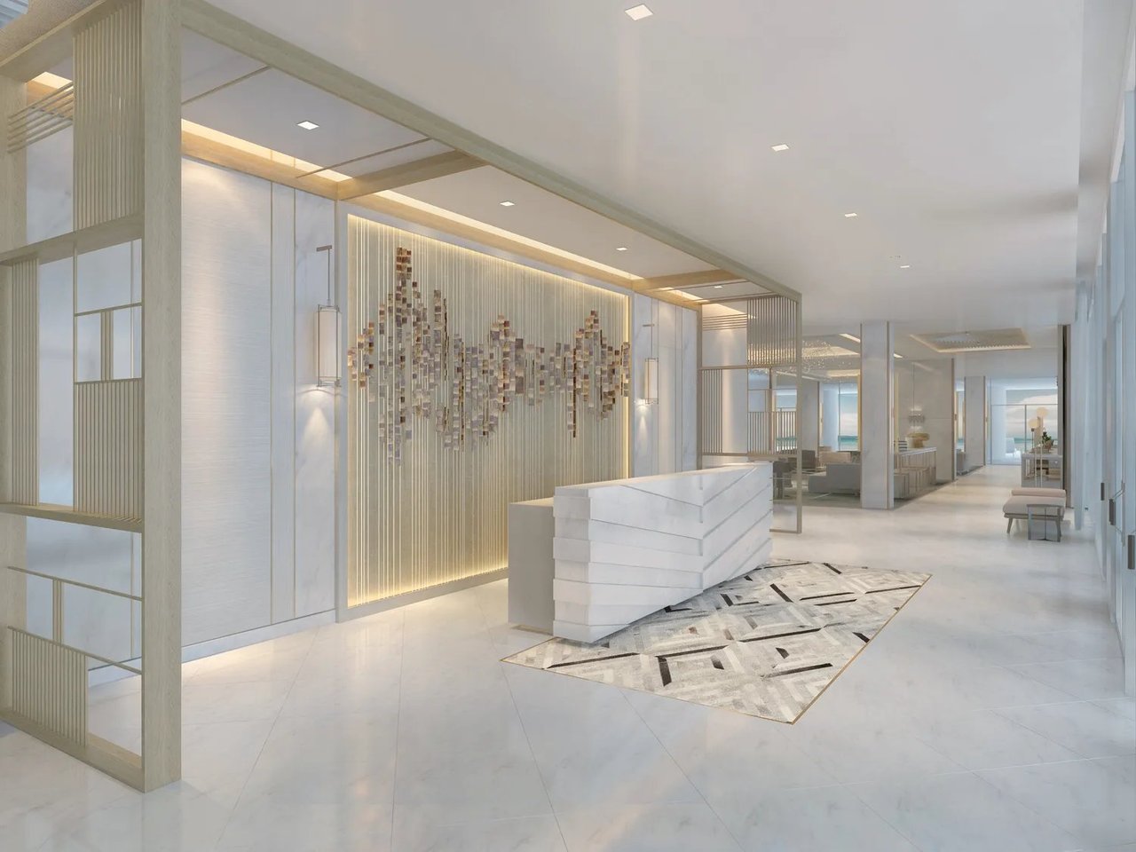 Contemporary development lobby with a white reception desk and illuminated wall art.