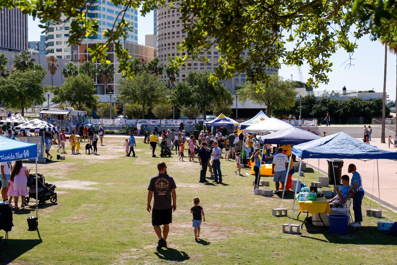 Families enjoying a community event at a Tampa Bay park before the start of the school year.