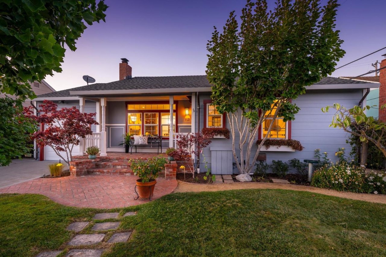 San Mateo Home in Bay Area painted blue and red with trees
