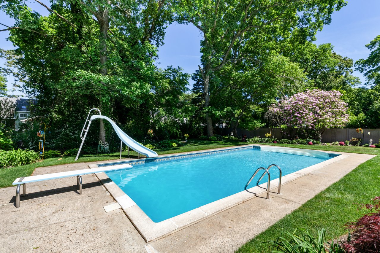 A Quiet Village Setting with a Pool at Its Center