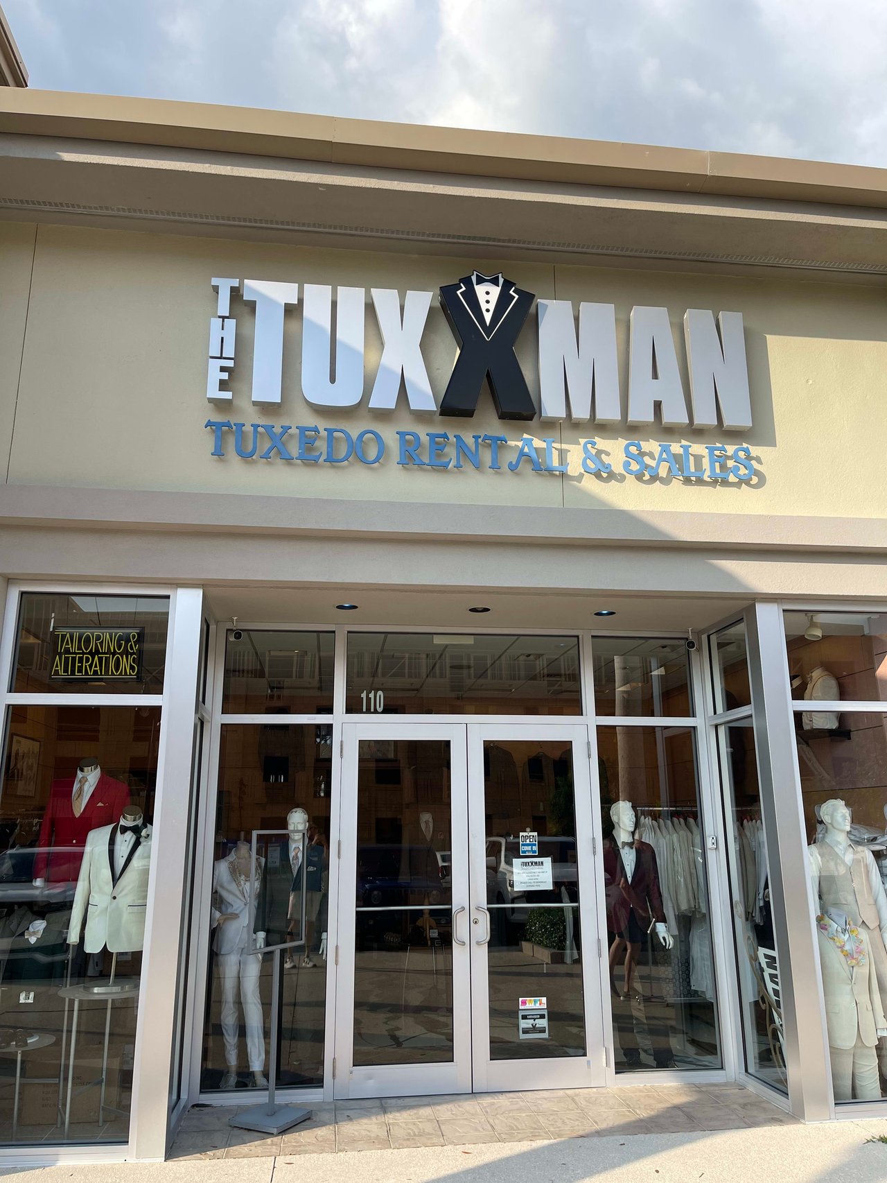 Sign for Tuxxman Estero Florida