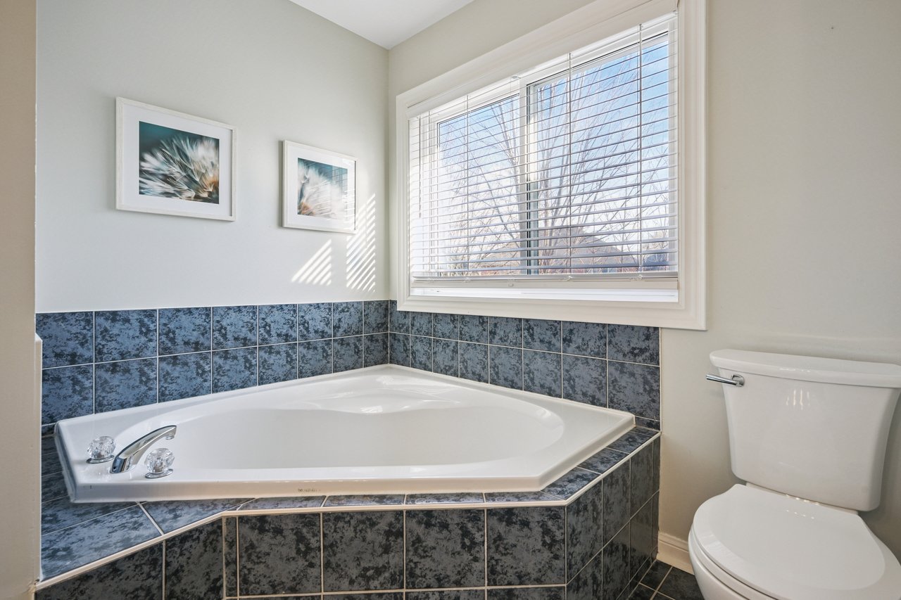 Sun-Filled Sophistication on a Rare Pie-Shaped Lot in West Oak Trails