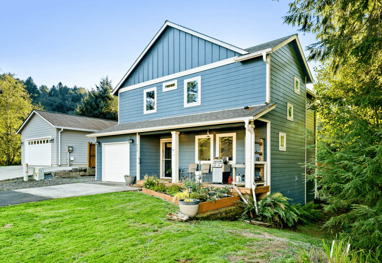 Sold updated coastal home at 215 S Neptune St in Rockaway Beach Oregon with wooded surroundings