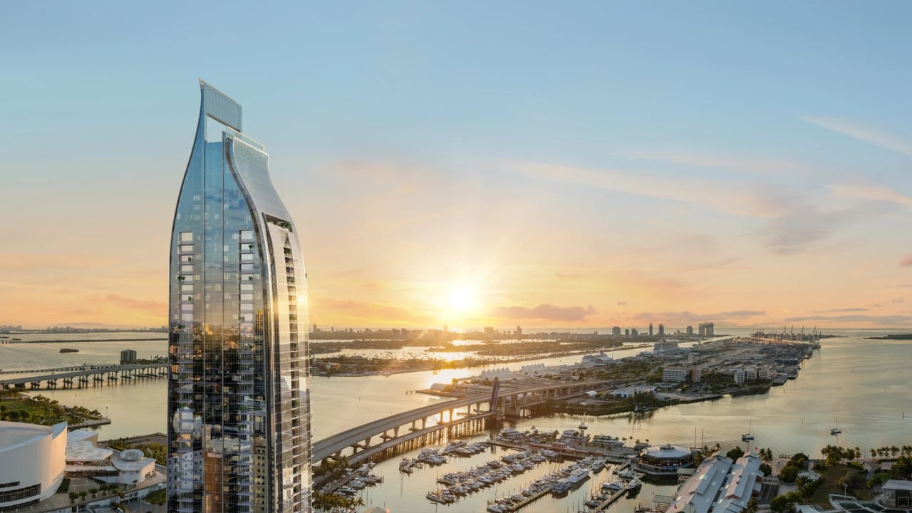 Delano Residences & Hotel Miami exterior tower rendering at sunset above Biscayne Bay.