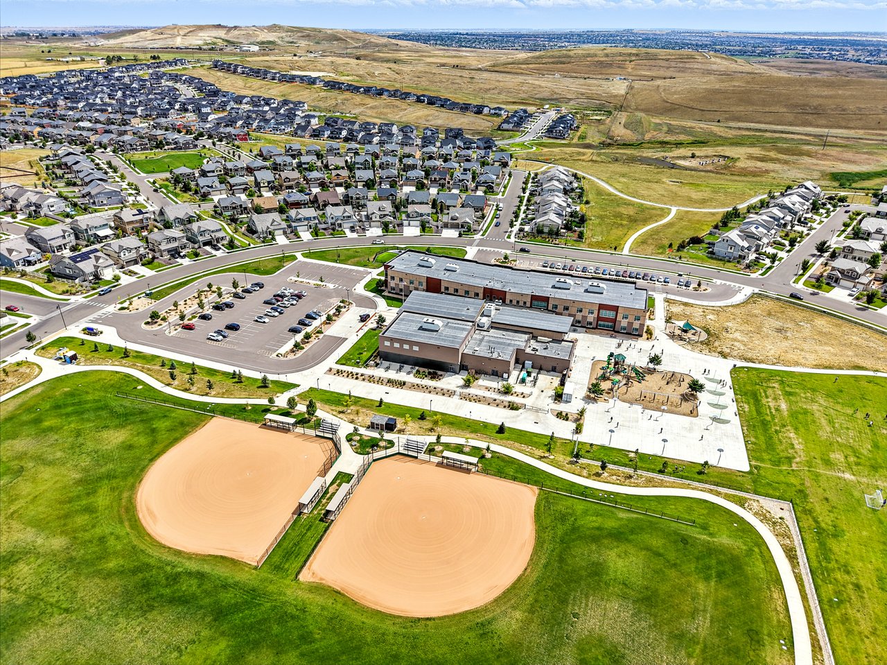Aerial perspective of residential streets and homes in The Highlands neighborhood of Denver, CO.