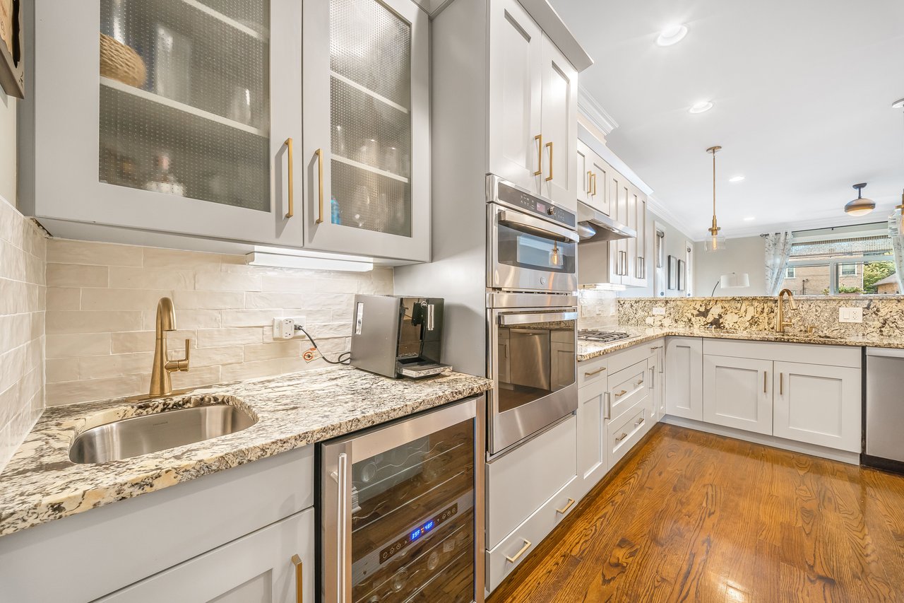 Butler's pantry next to the kitchen, with sink and wine fridge