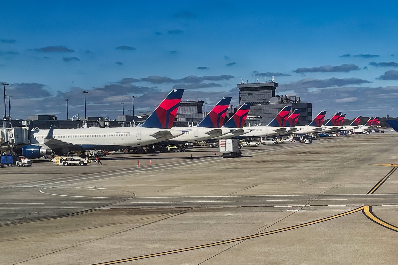 Commercial aircraft at a major airport illustrating convenient travel connections for River Green homeowners.