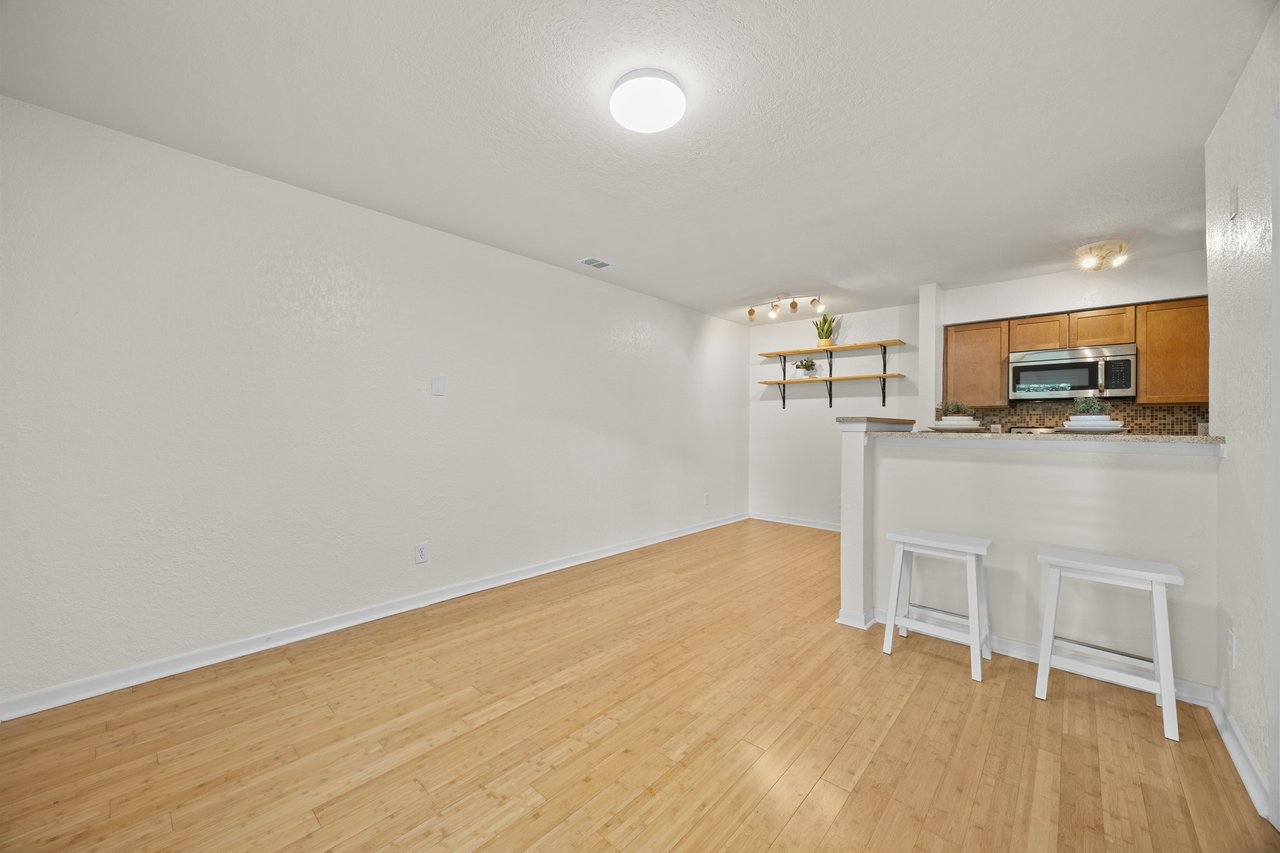 Top-Floor Condo Retreat in Gated Ivy Condos | Private Balcony + Tree-Filled Views