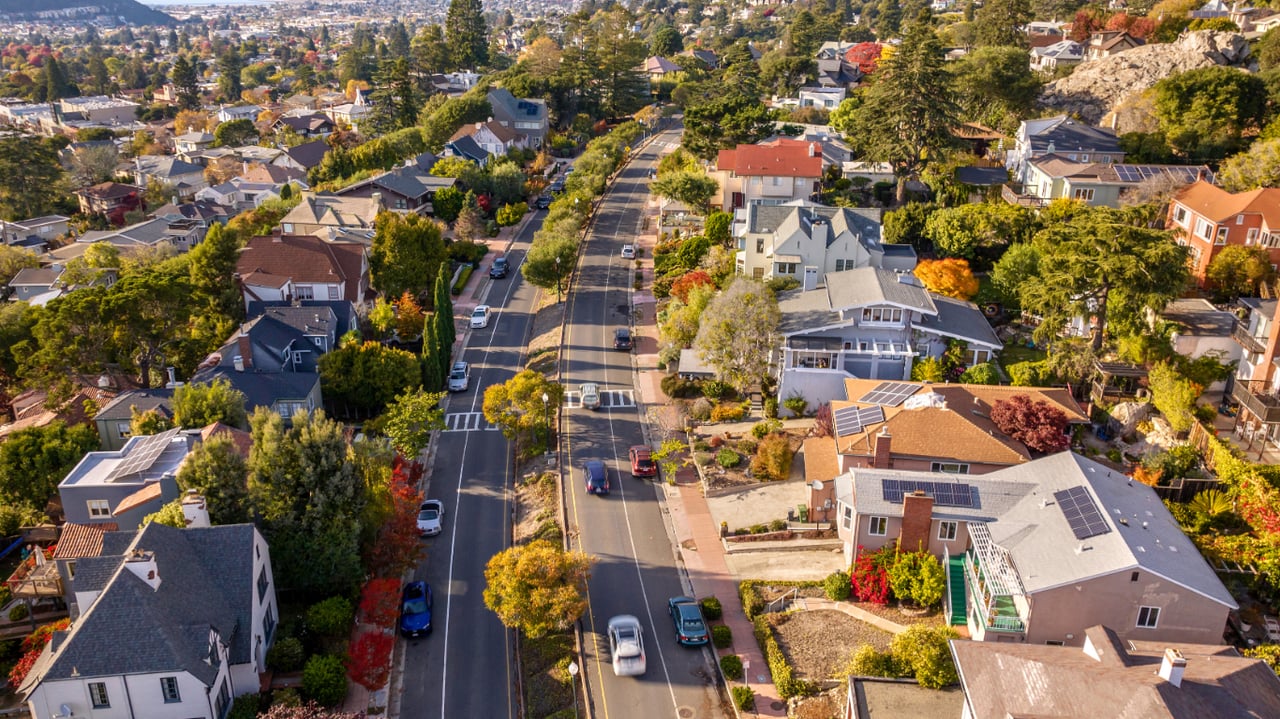 Aerial view of a San Francisco residential neighborhood with tree-lined streets and hills