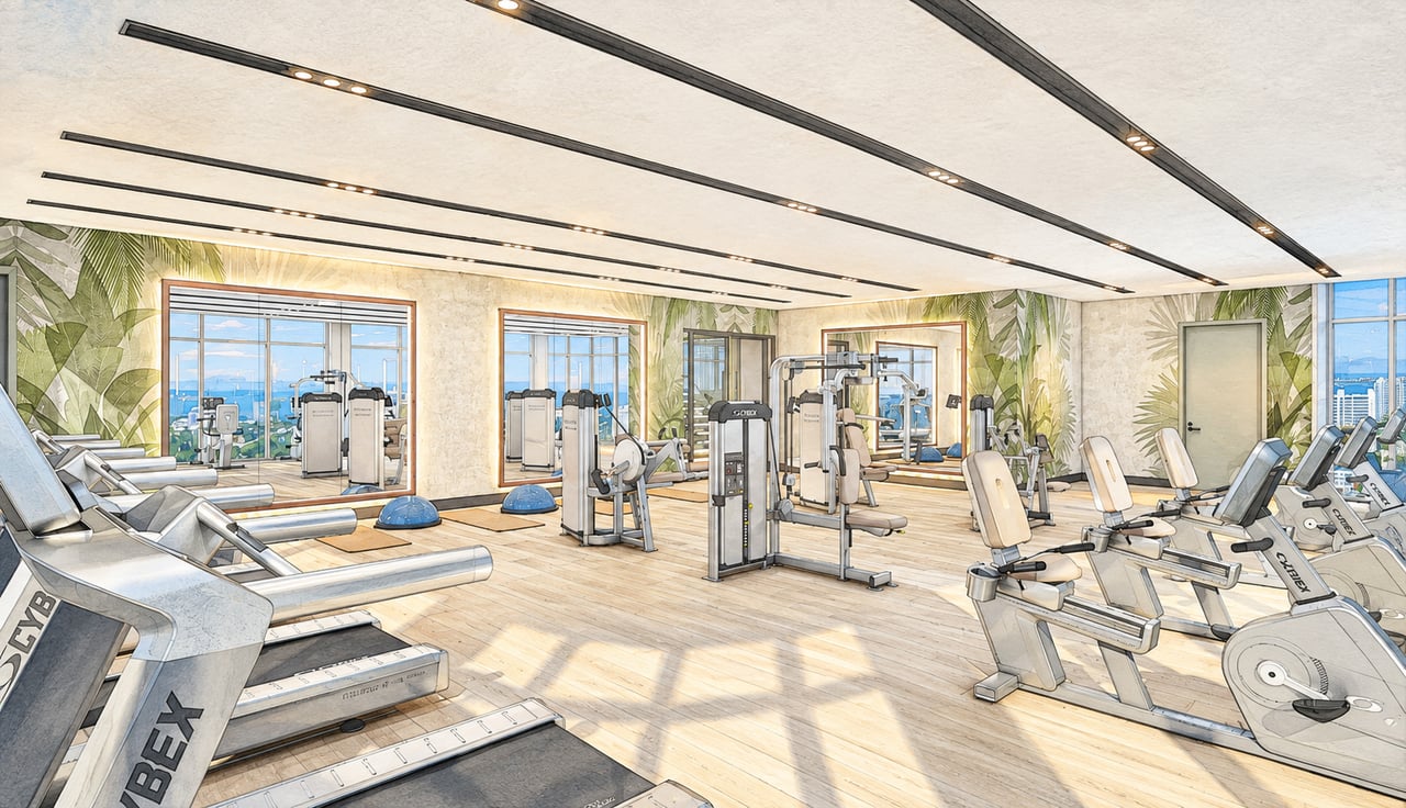 Saravela fitness center with rows of exercise equipment, tropical murals, and city views.