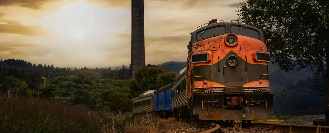 Garibaldi train with the old mill smoke stack in the background