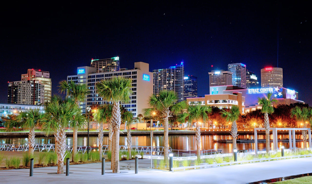 Downtown Tampa skyline and Tampa Riverwalk at night during Halloween season in Tampa Bay Florida