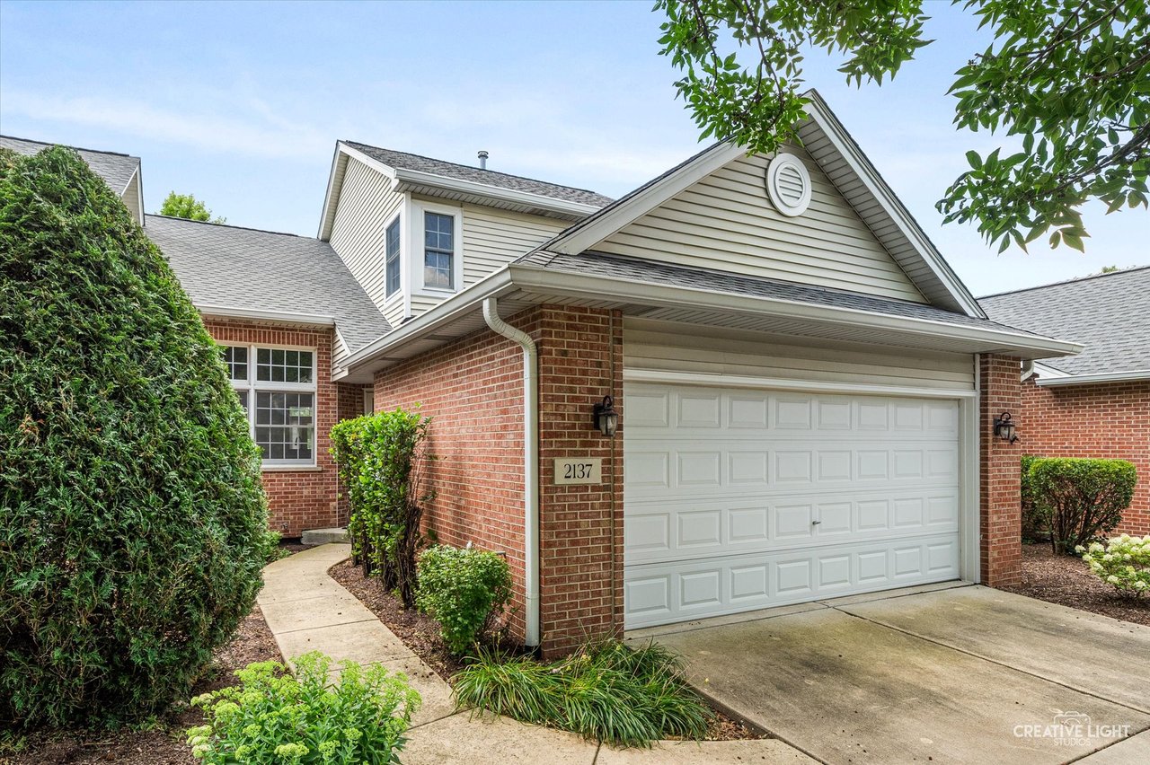Front exterior of townhome at 2137 Prairie Lane Woodridge IL in Water Tower Reserve