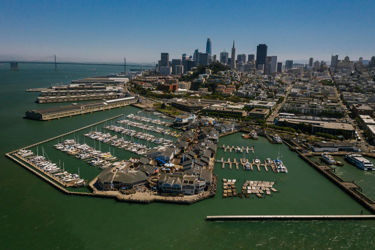 Aerial view of Marina District San Francisco waterfront with city skyline — luxury real estate 94123