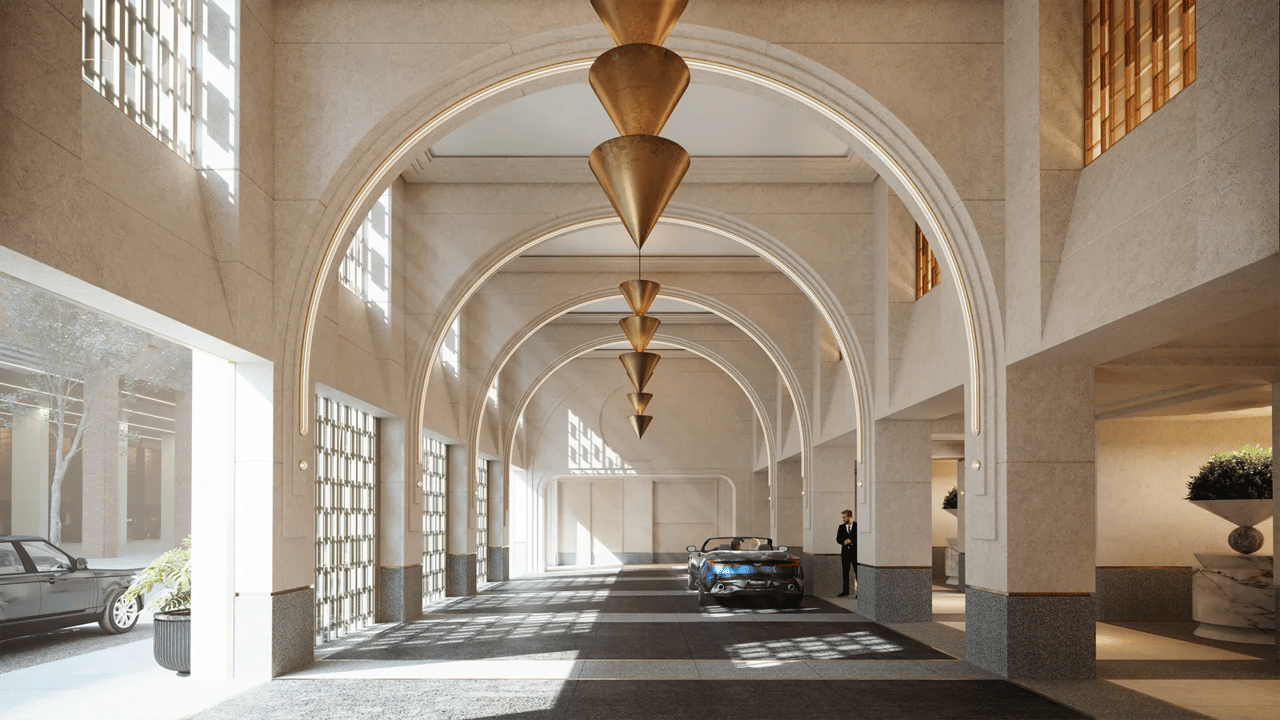 Grand arched entrance drive with bronze pendant lights and a blue car beneath the covered porte cochere.