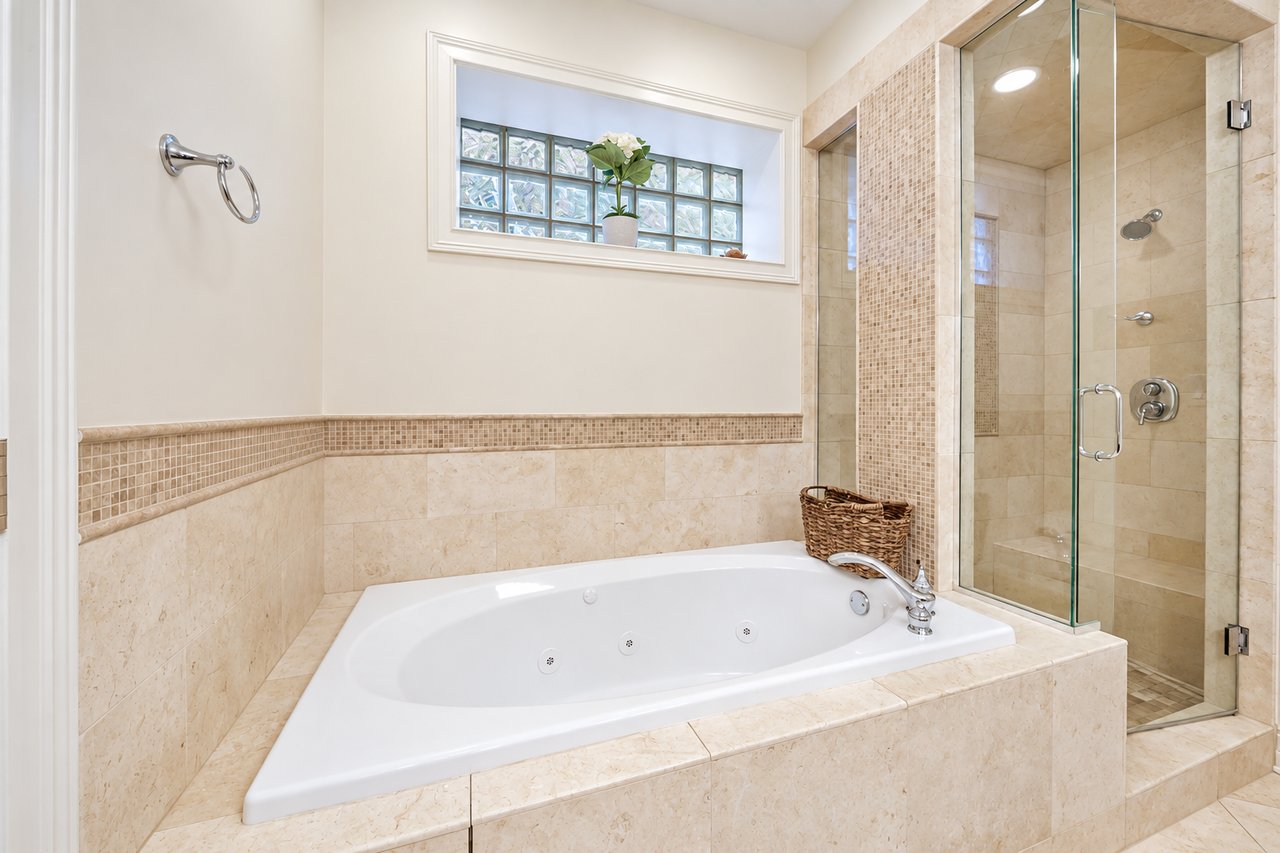 Primary bathroom with soaking tub and separate shower