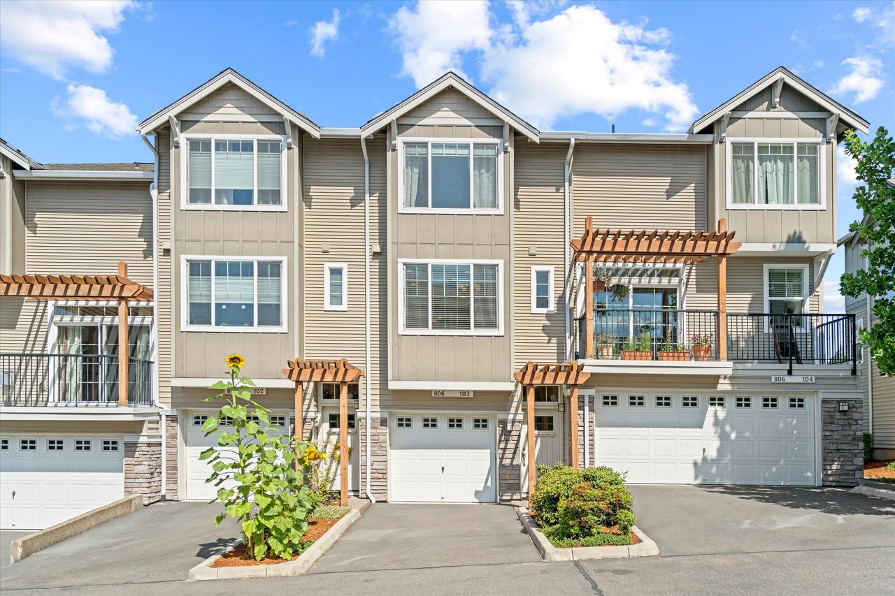 Exterior view of a stylish condo at 806 NW 118th Ave in Portland, Oregon, located in the Timberland community. The image highlights modern architecture, natural surroundings, and convenient access to local amenities.