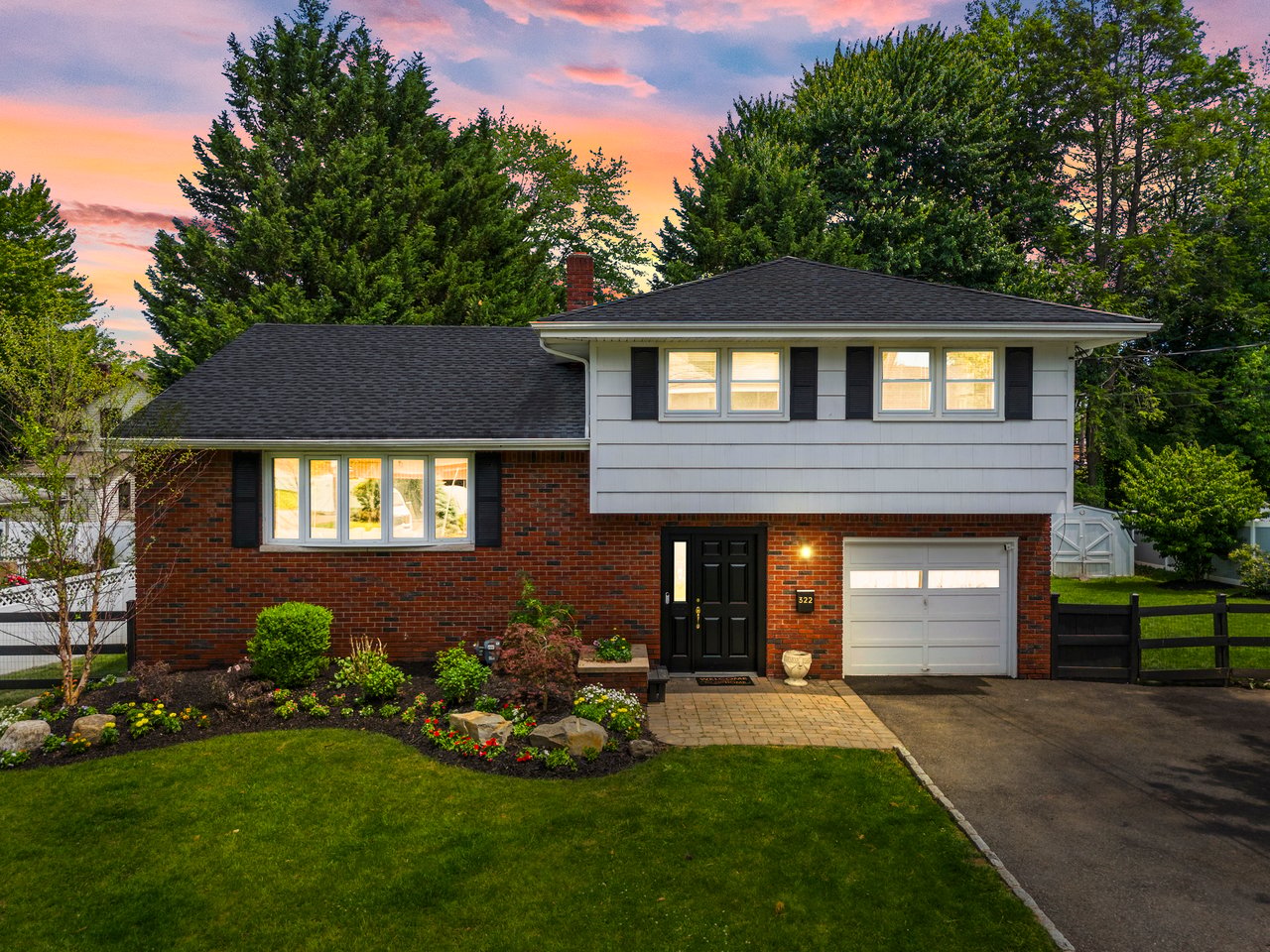 Sunset exterior of a residential property with landscaped yard in Northvale, NJ, listed by Realtor Lana Henriques.