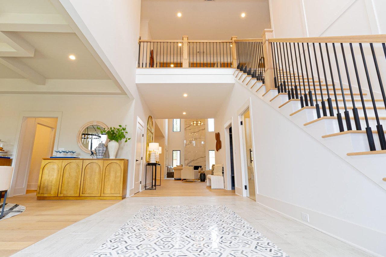 Grand foyer of Ridgewater Bleu home in Marietta GA, showcasing high ceilings, exquisite detailing, and a welcoming entrance in the desirable East Cobb area.