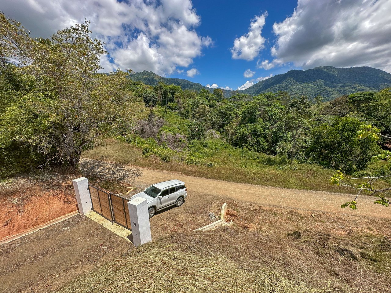 An elevated, prepared river lot with 360-degree ocean, mountain, valley and jungle views