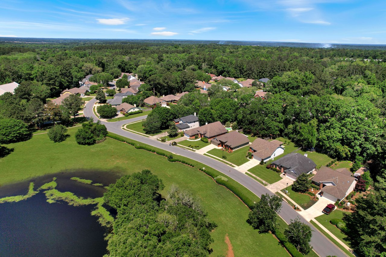 Another aerial view of the Ox Bottom Manor community, highlighting the layout of the houses and nearby water features.