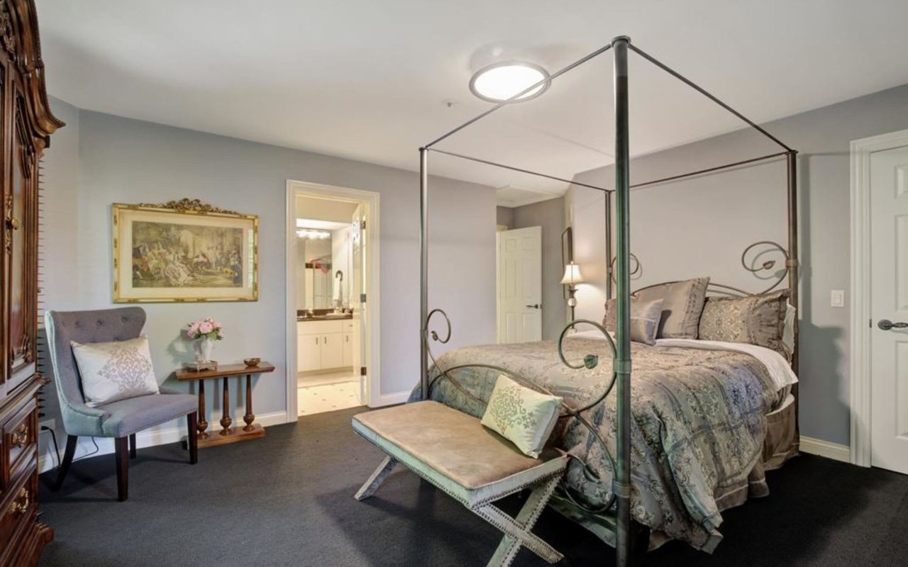 This Stately Brick Traditional Home Is Uniquely Positioned On One Of The Most Private Lots In Royal Melbourne