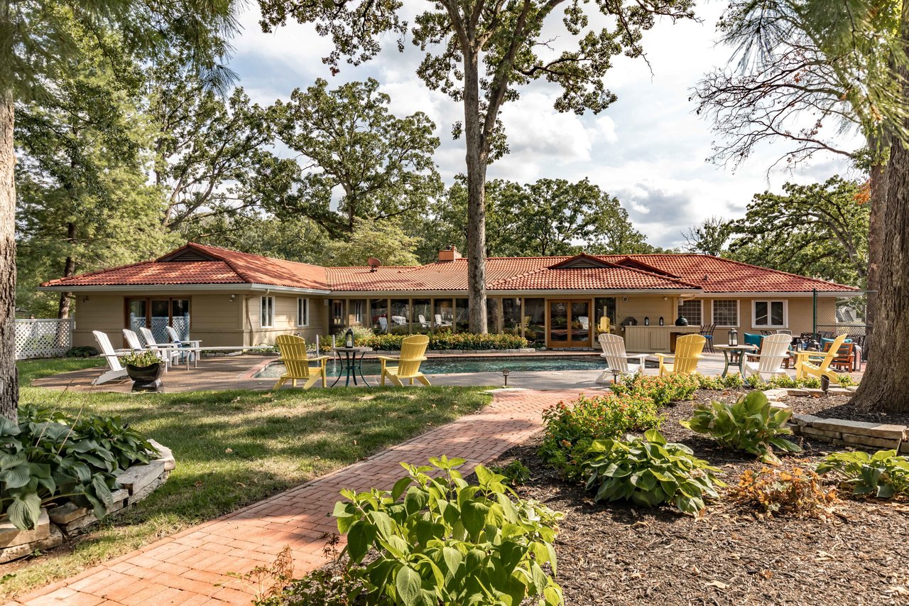 A Special Retreat on a Prized One Acre Lot With Pool and Tennis Court