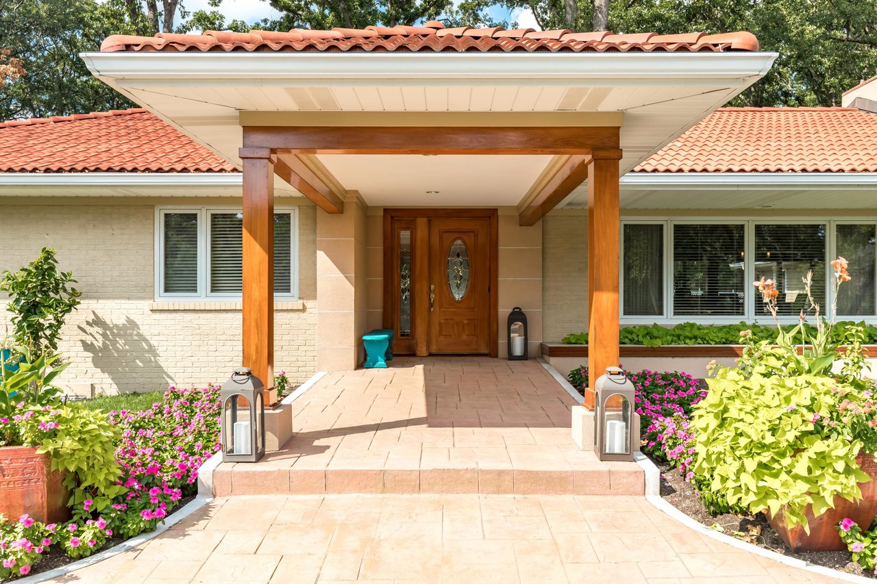 A Special Retreat on a Prized One Acre Lot With Pool and Tennis Court
