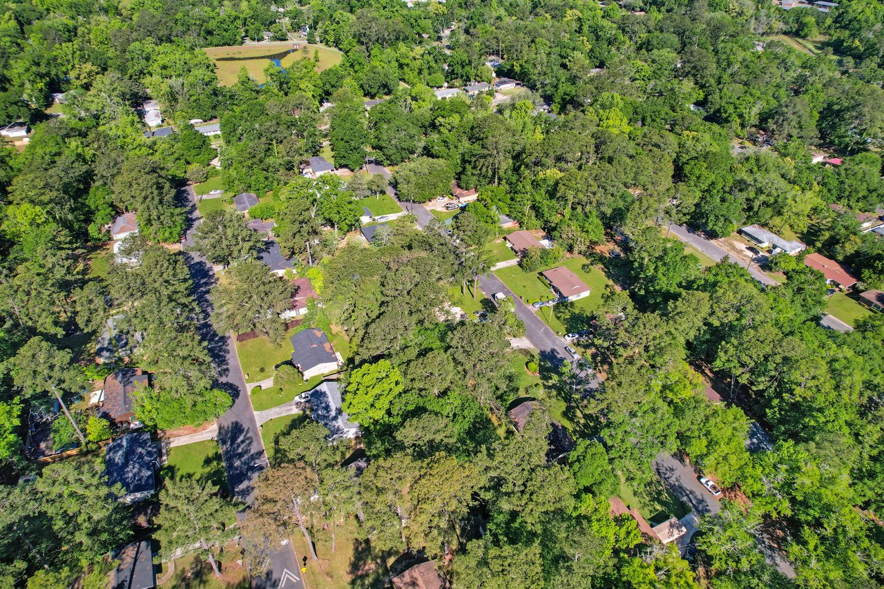 Aerial view of Apalachee Ridge Estates focusing on a different area, showing houses and green spaces.